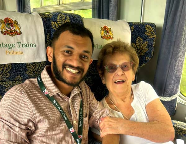 carer and client on a steam train trip